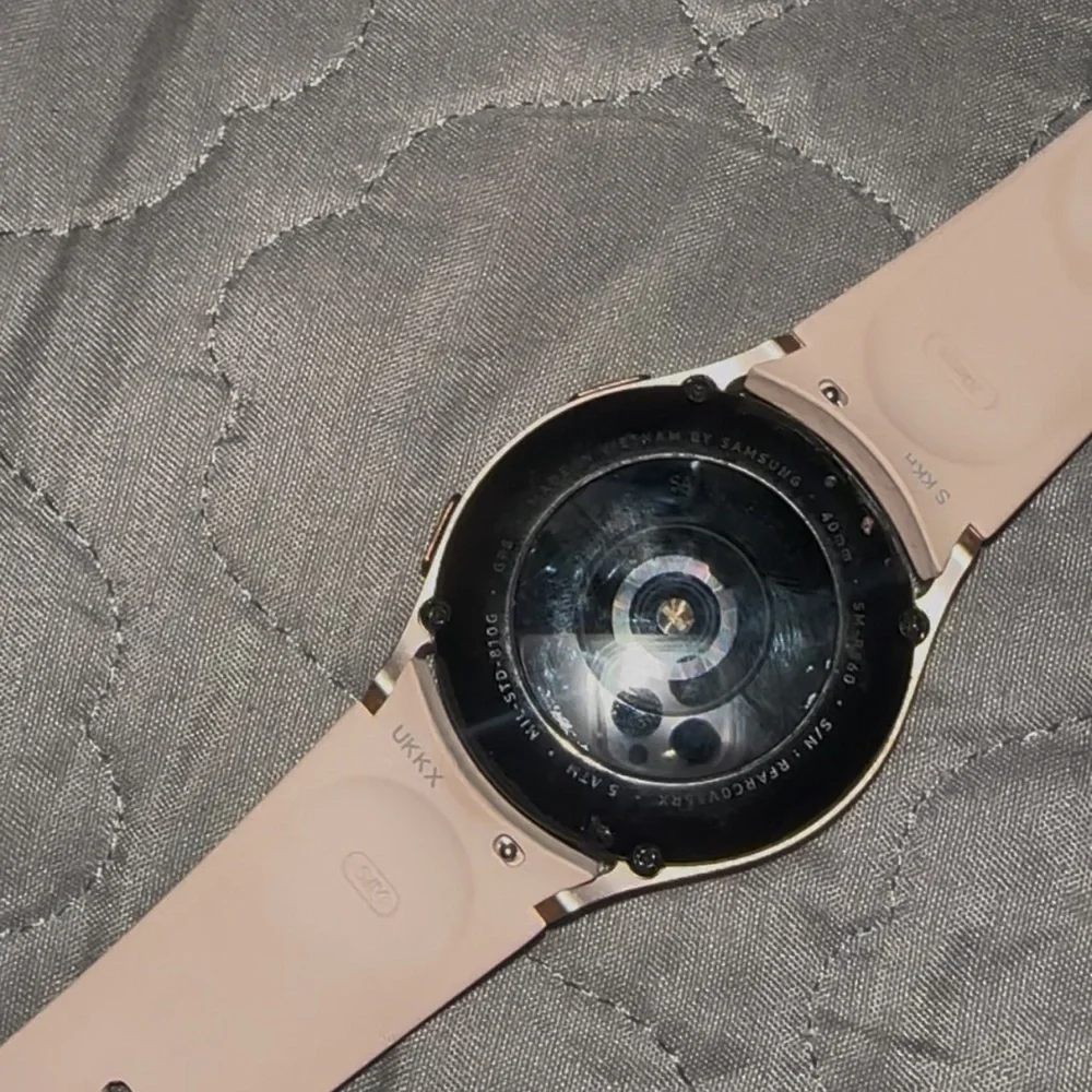 Samsung Black Smartphone with Pink Smartwatch